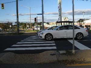 Two cars in the crosswalk