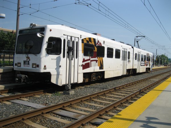 Light rail train leaving Camden Yards station