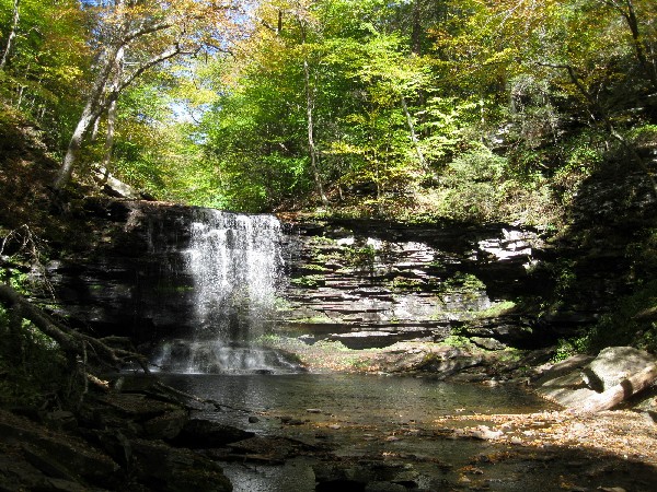 Water flowing over flat, broken layers of rock